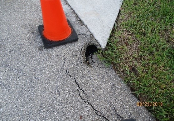 The small sink hole that was observed in front of 253 Sunrise Cay last month is being addressed by Florida Utility Solutions. Picture #2.